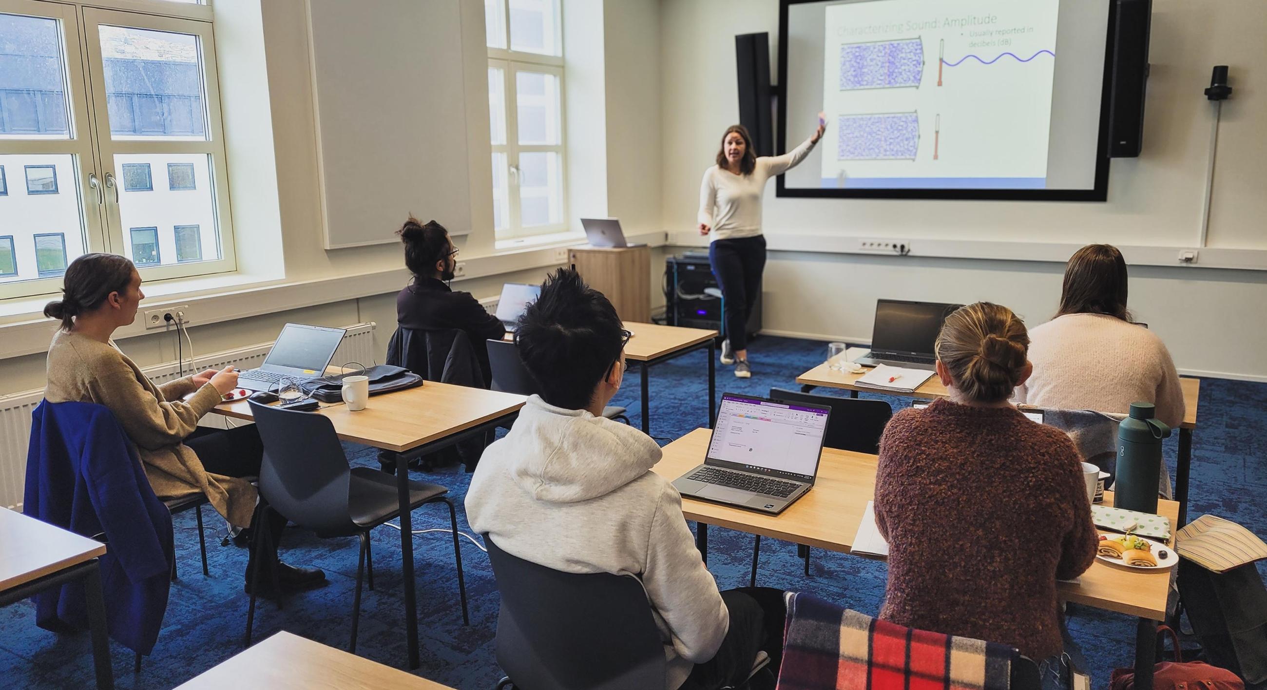 Lora Van Uffelen giving lecture in ocean acoustics